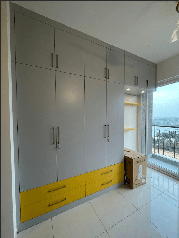 Custom wardrobe with accent colour drawers